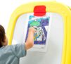 Deluxe Magnetic Double-Sided Easel. Picture hanging from large paperclip while child drawing.