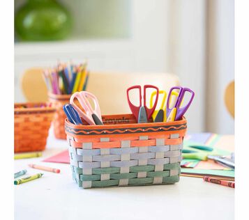Crayola x Longaberger Artist Utility Basket. Basket filled with supplies on tabletop.