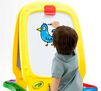 Deluxe Magnetic Double-Sided Easel. Child drawing a bird on white board with crayola dry-erase crayons. 