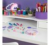 Glitter Dots Kits Sparkle Salon contents displayed on child's desk.