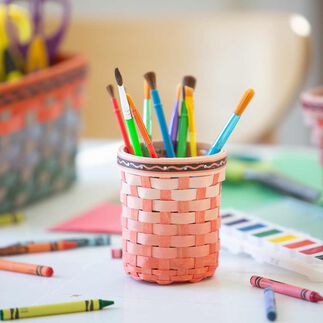 Crayola x Longaberger Marker Holder Basket Set, Scarlet, sitting on table with art supplies.